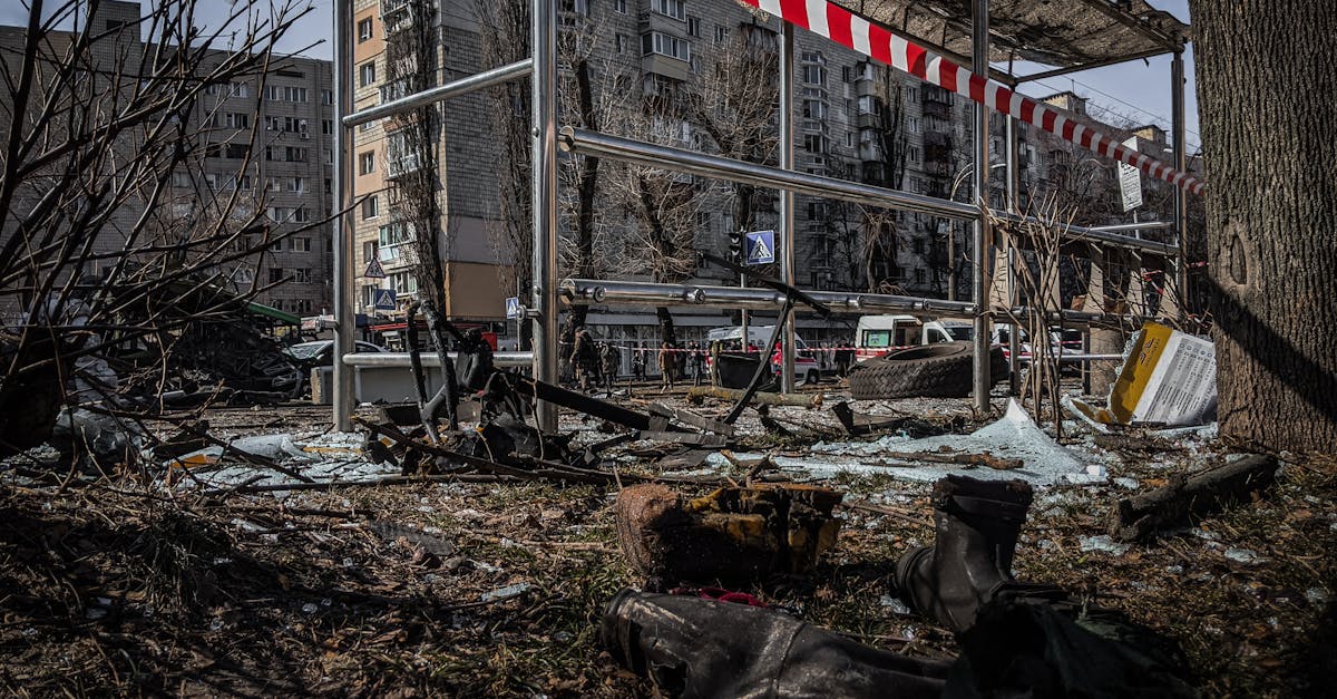 A demolished bus stop in Kyiv, Ukraine, showcasing signs of conflict and devastation.
